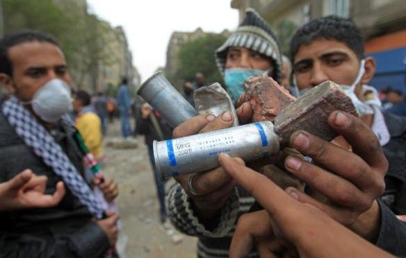 Egyptian protesters point to the "Made in USA" tag on a tear gas canister used against them near Tahrir Square, November 20, 2011. Photo: Khaled Dessouki for AFP